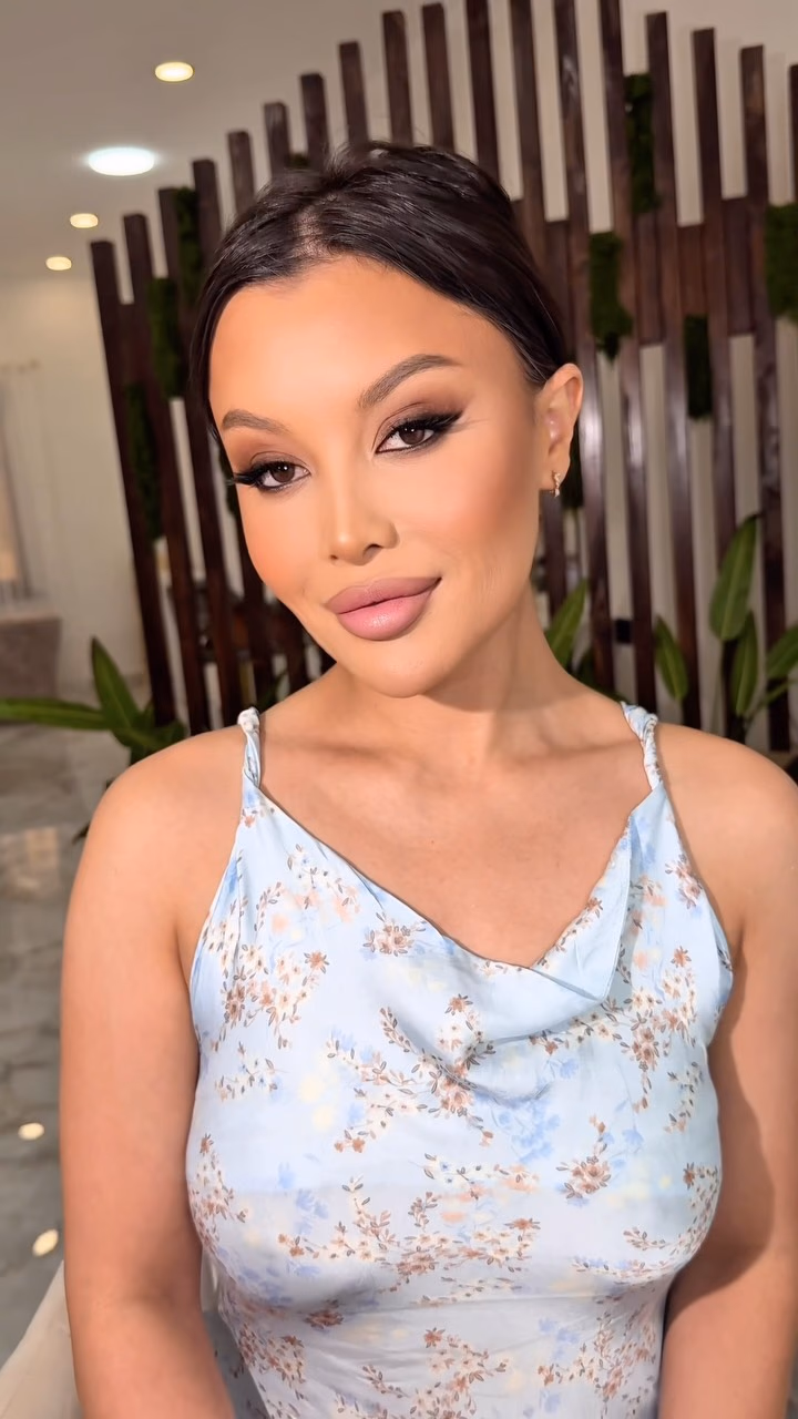 Soft glam makeup with warm shimmer on the lids and a rose nude lip